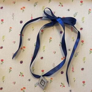 Vintage watch necklace on silk